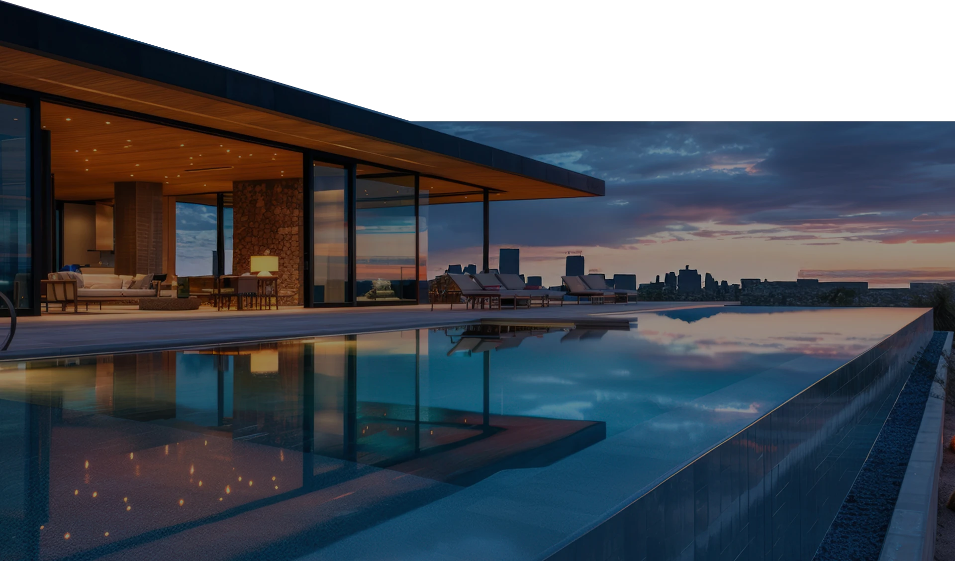 Luxury property exterior with pool at dusk